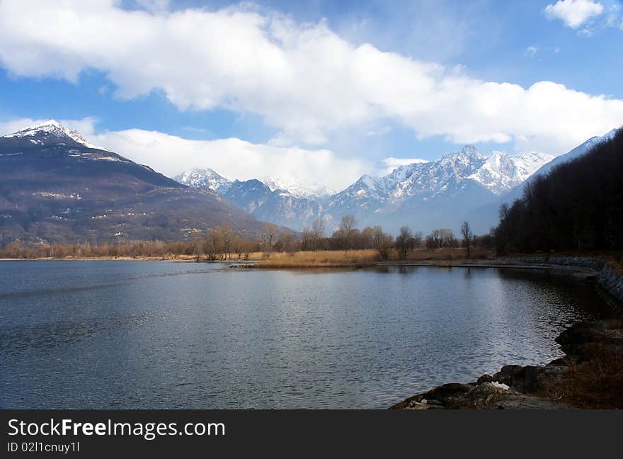 Lake with trees and grass on the banks