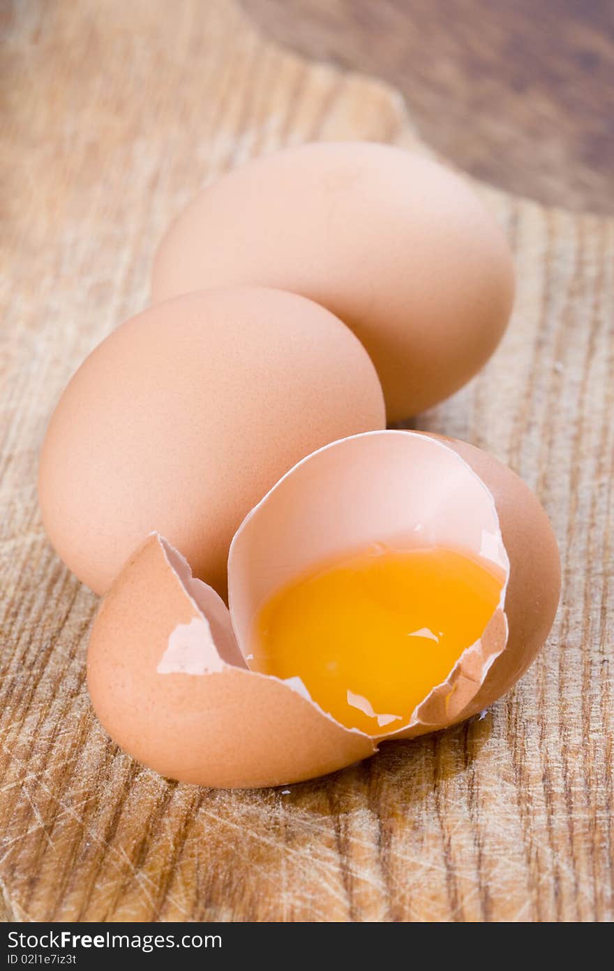 Whole And Broken Brown Eggs