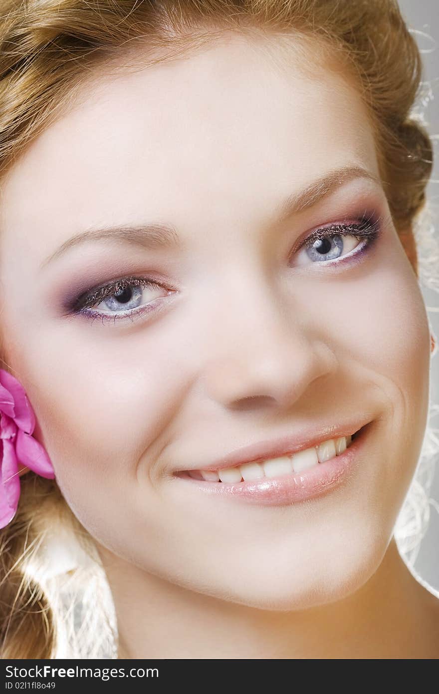 Portrait of young woman with with flowers in hair. Portrait of young woman with with flowers in hair