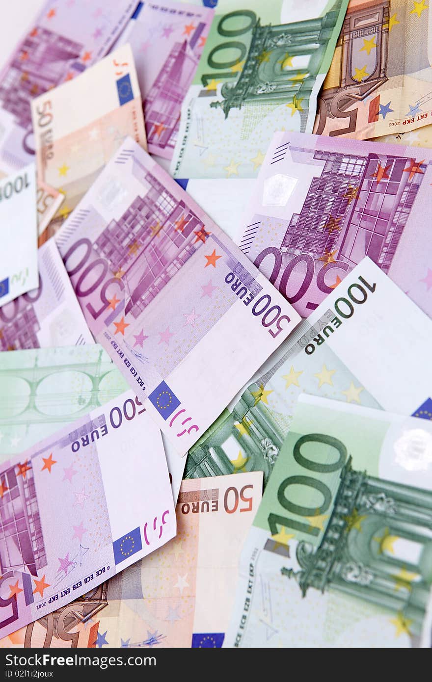 Euro banknotes of various denominations are on the table. Euro banknotes of various denominations are on the table