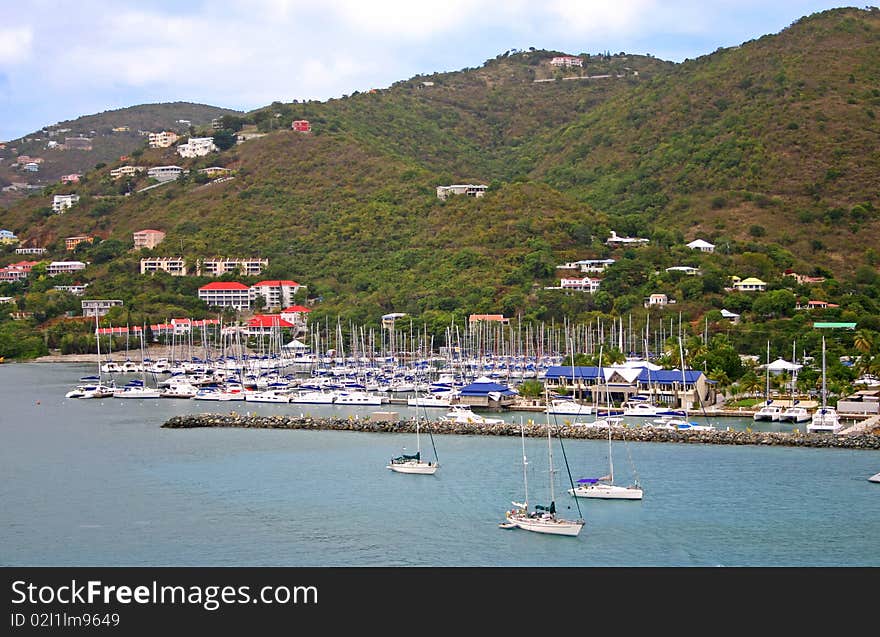 Sailboats crowded into a marina on the Caribbean island of Tortola, British Virgin Islands. Sailboats crowded into a marina on the Caribbean island of Tortola, British Virgin Islands