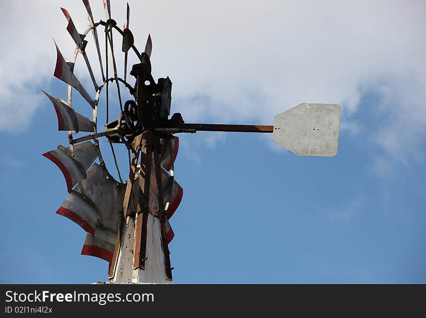 Windmill againt a brillant blue sky.