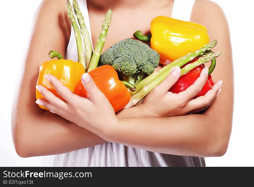 Young beautiful woman with fresh vegetables in her hands. Young beautiful woman with fresh vegetables in her hands