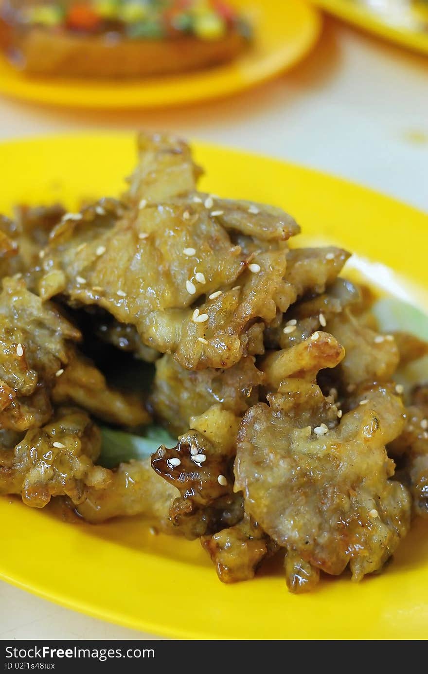 Deep fried mushroon delicacy made from abalone mushrooms. Concepts such as food and beverage, and travel and cuisine, and diet and nutrition. Deep fried mushroon delicacy made from abalone mushrooms. Concepts such as food and beverage, and travel and cuisine, and diet and nutrition.