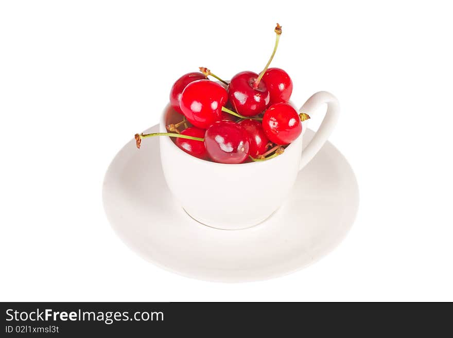 Cherry in cup isolated on the white background