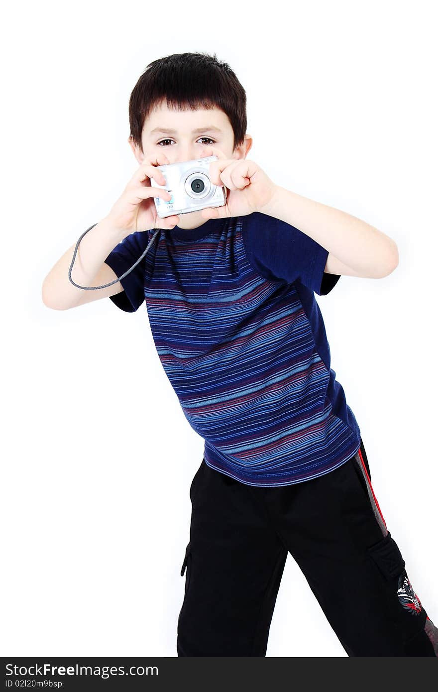 Young boy with digital camera prepare for shooting