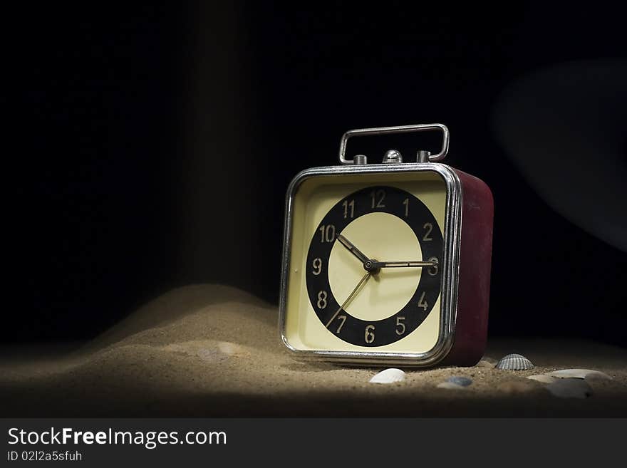 Old clock drowning in sand. Old clock drowning in sand