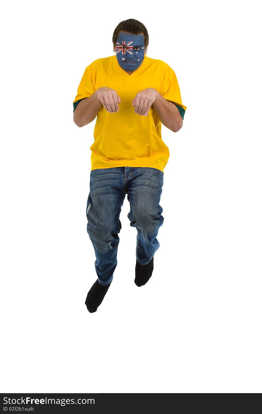 Man with australian shirt and australian flag on his face pretending to be a kangaroo, jumping isolated on white background. Man with australian shirt and australian flag on his face pretending to be a kangaroo, jumping isolated on white background