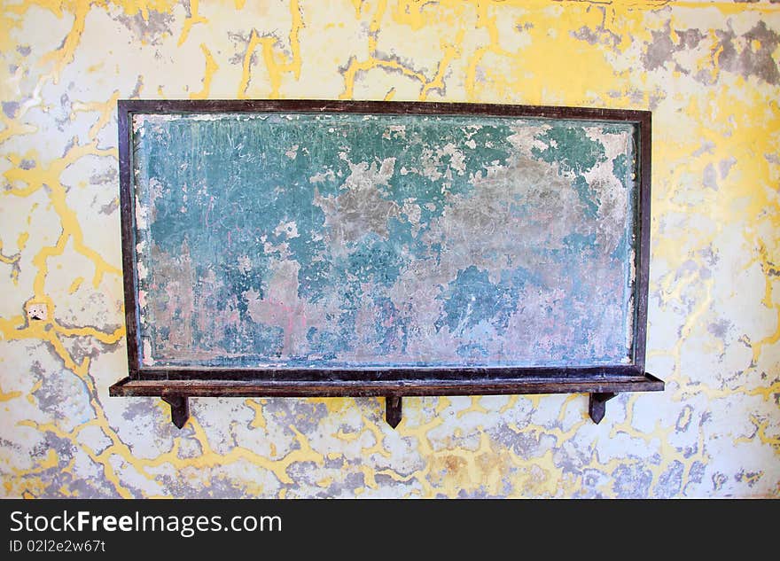 School chalkboard in shabby classroom