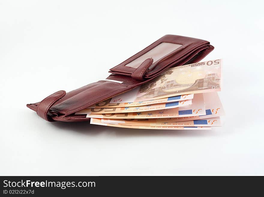 Banknotes falling from the wallet located on a white background. Banknotes falling from the wallet located on a white background