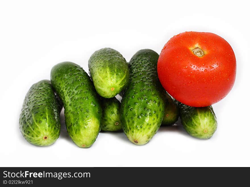 Red tomato and cucumber isolated on white background