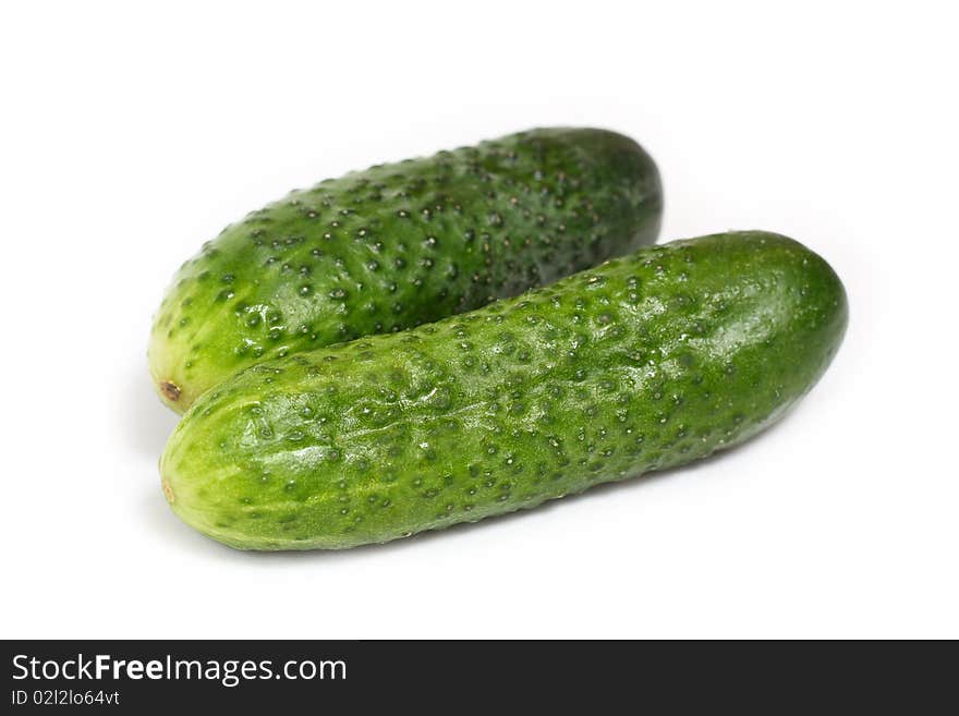 Green cucumbers isolated on white background