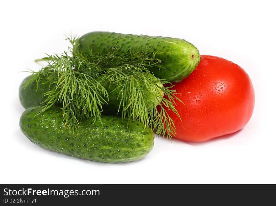 Red tomato and cucumber isolated on white background