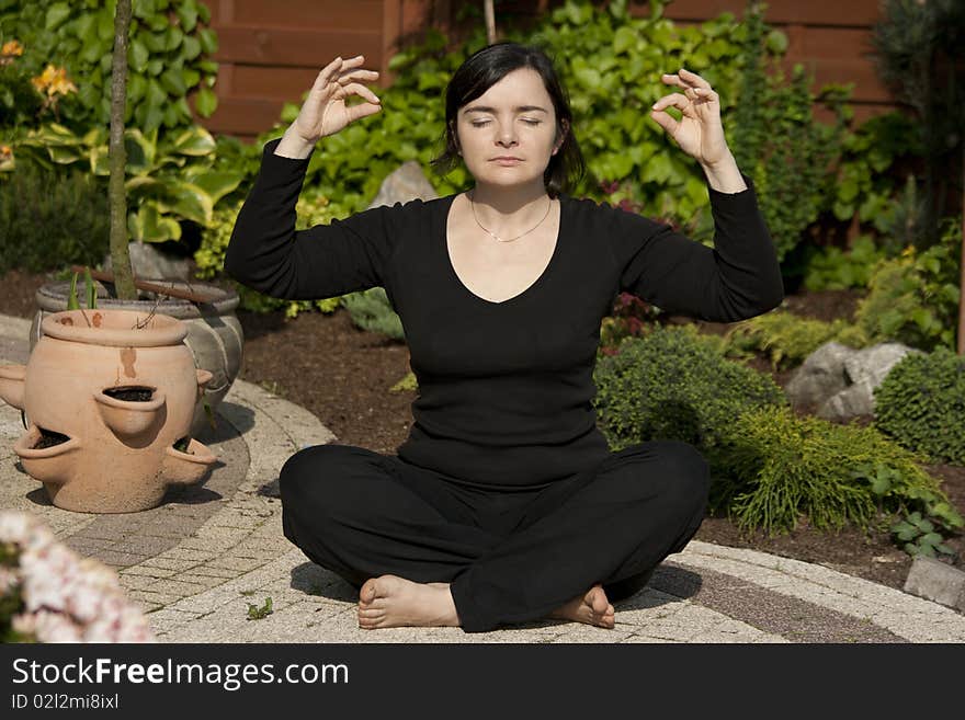 Young woman meditating in nature. Young woman meditating in nature