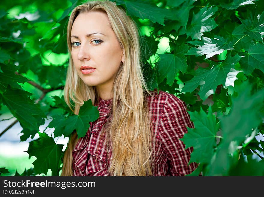 Blond girl relaxing outdoors