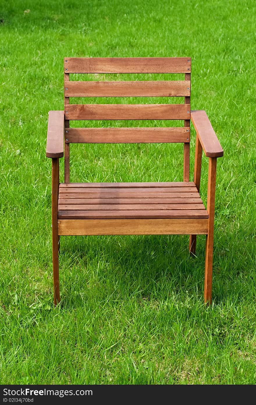 Wooden chair on green grass