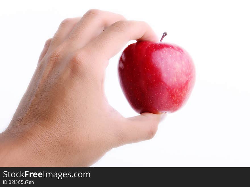 Red apple on man hand over white background. Concepts: Nutrition, Food, Health & Wellness