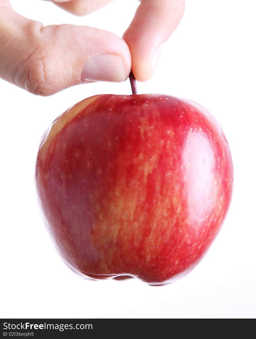 Red apple on man hand over white background. Concepts: Nutrition, Food, Health & Wellness. Red apple on man hand over white background. Concepts: Nutrition, Food, Health & Wellness