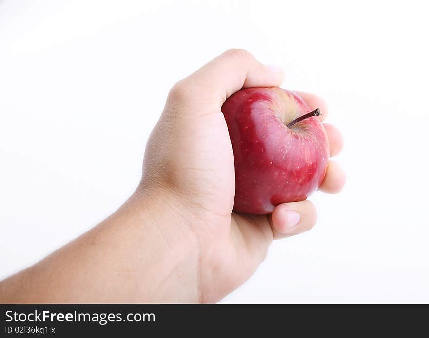 Red apple on hand over white background. Red apple on hand over white background