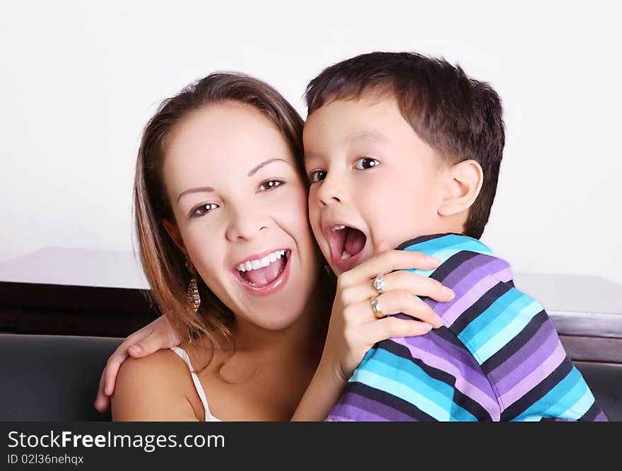 Child and his mother playing and smiling. Child and his mother playing and smiling