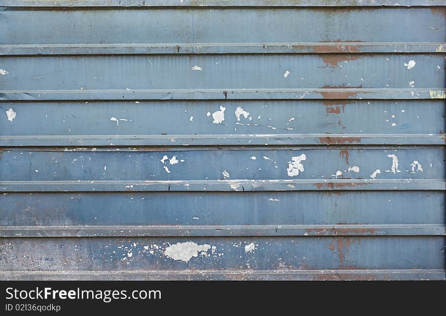 Old blue brass wall with a worn out paint