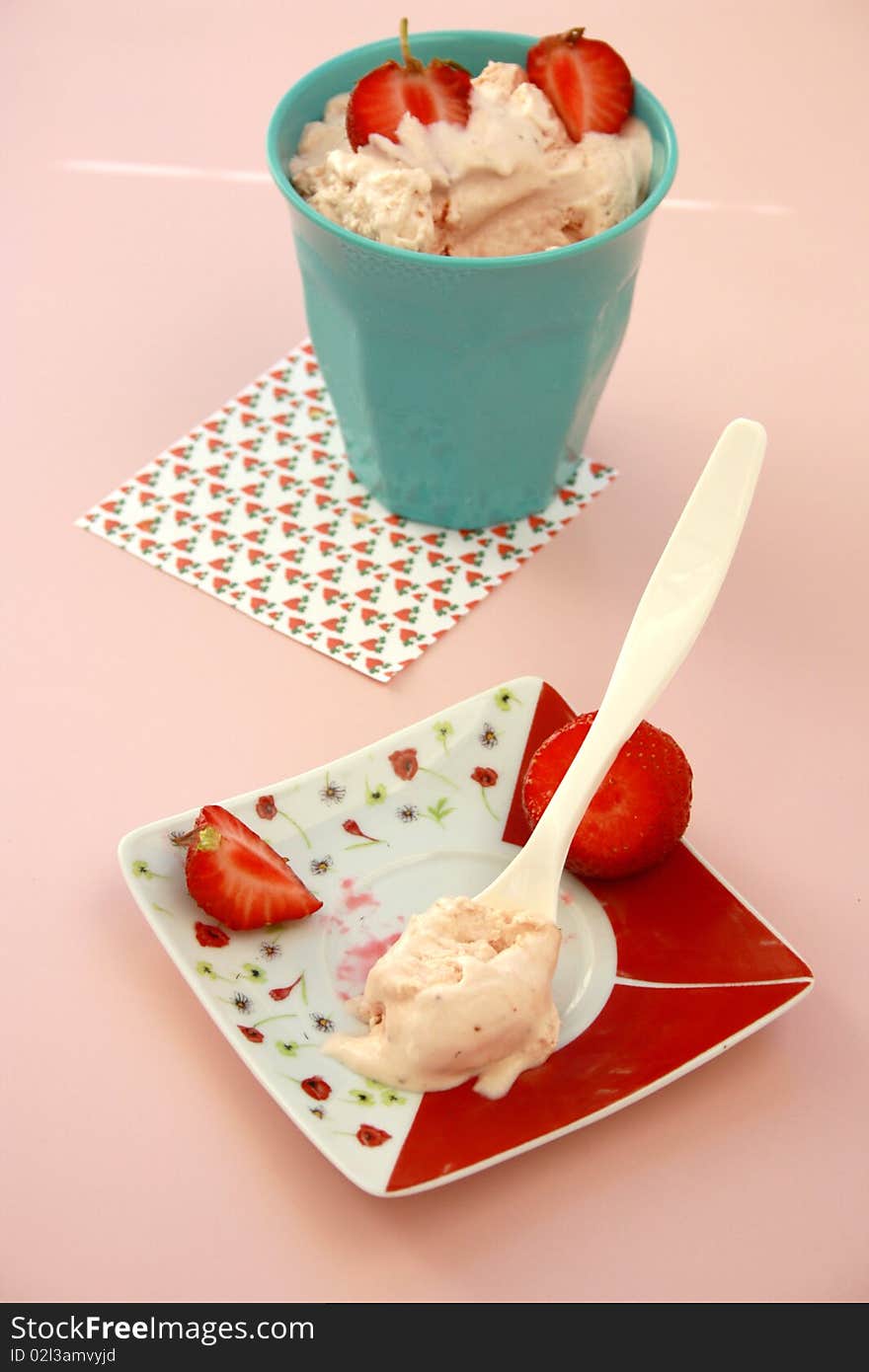 Strawberry ice cream on a pink background