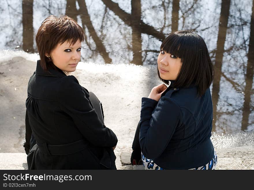 Two female friends walking outdoor. Two female friends walking outdoor