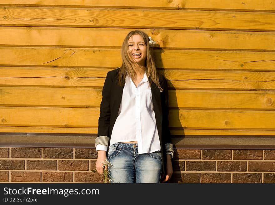 Girl standing in front of a  house