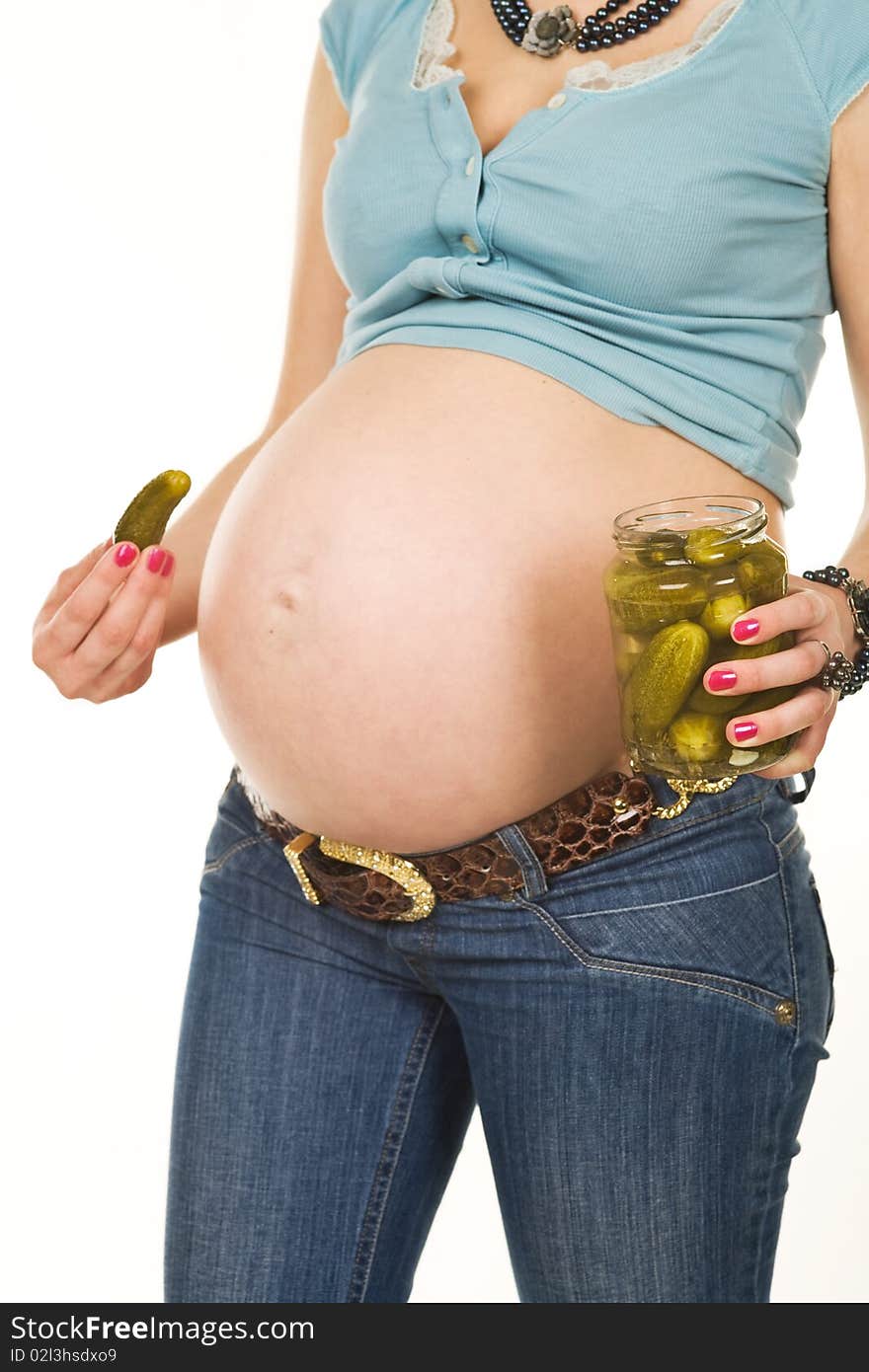 Belly of a pregnant woman and pickles, isolated on white. Belly of a pregnant woman and pickles, isolated on white