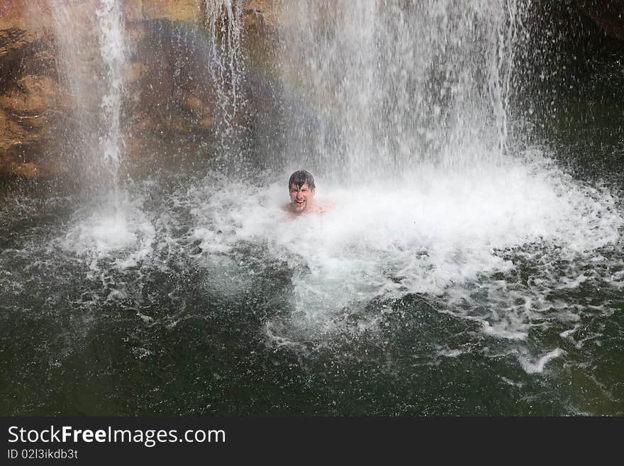 Rainbow, Waterfall And Swimming Person