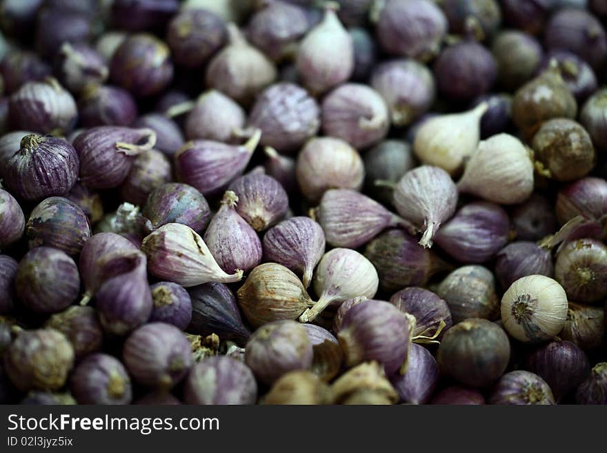 Violet shallots on a market table