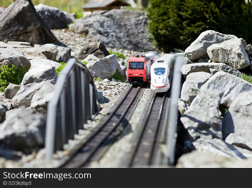 Photo of two toy trains, outside imitation