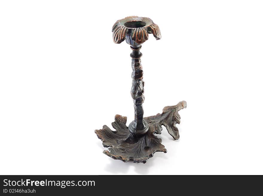 Old metal candle holder isolated on a white background