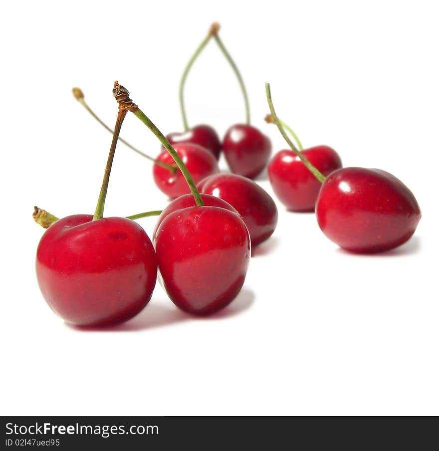 Juicy cherries isolated on white background