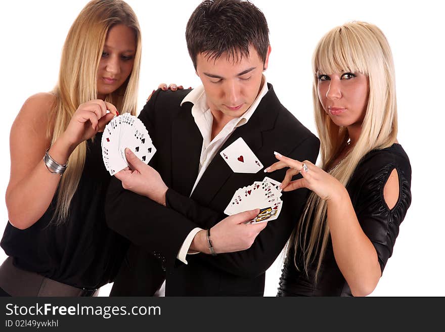 Magician make performance cards with two beauty girls