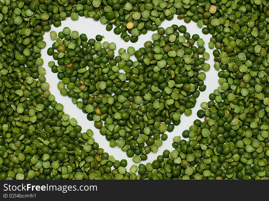 Heart on pea background