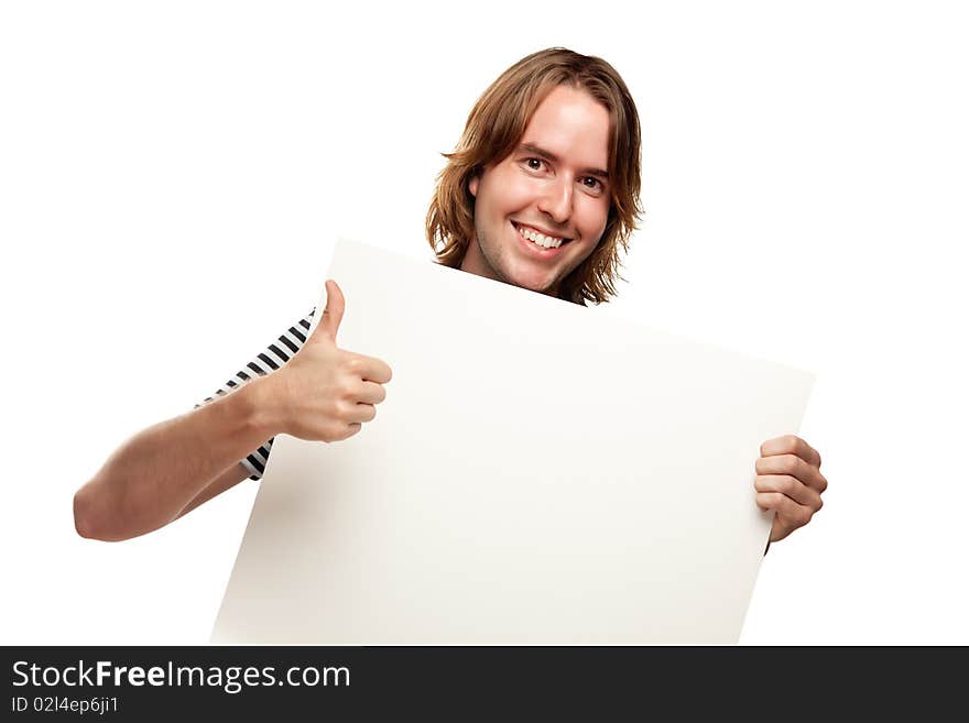 Smiling Young Man with Thumbs Up Holding Blank White Sign Isolated on a White Background. Smiling Young Man with Thumbs Up Holding Blank White Sign Isolated on a White Background.