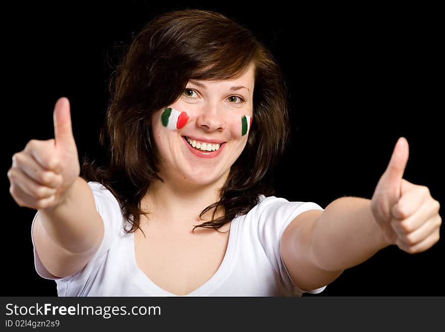 Young female show thumb up gesture, italian team supporter with flags painted on her cheeks, studio shoot isolated on black background. Young female show thumb up gesture, italian team supporter with flags painted on her cheeks, studio shoot isolated on black background