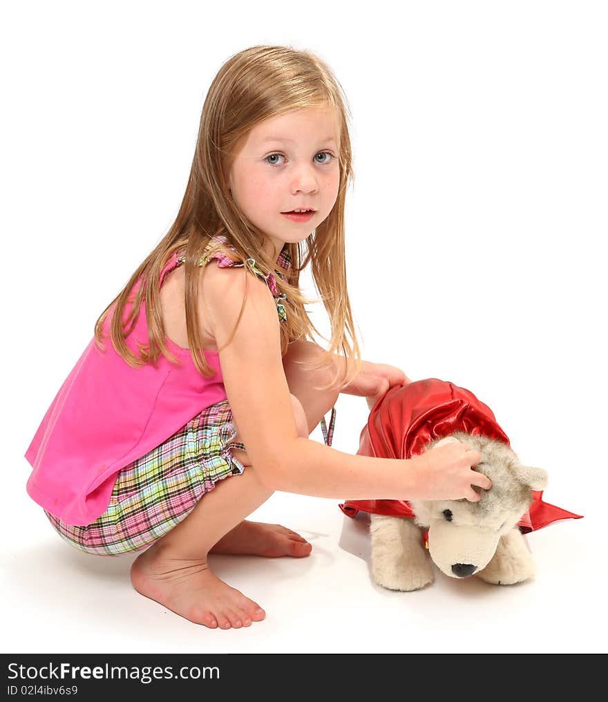 Adorable five year old girl playing with her wonder dog.