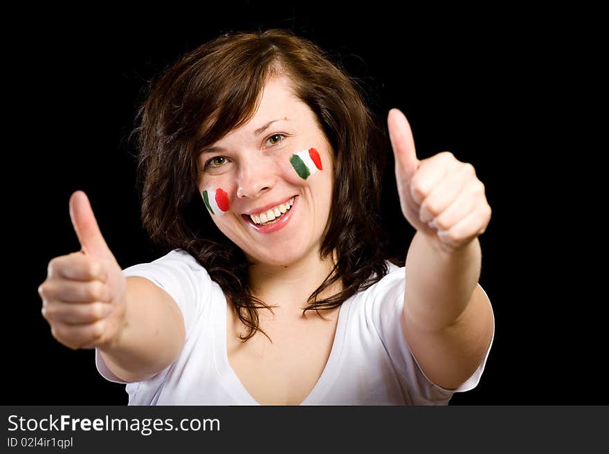 Young female show thumb up gesture, italian team fan with flags on her cheeks, studio shoot isolated on black background. Young female show thumb up gesture, italian team fan with flags on her cheeks, studio shoot isolated on black background