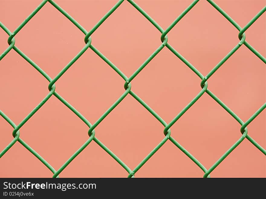 Close-up green chain link fence. Close-up green chain link fence