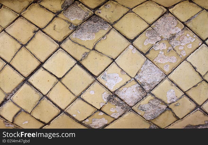 Old ceramic tile on a bathroom floor for background.