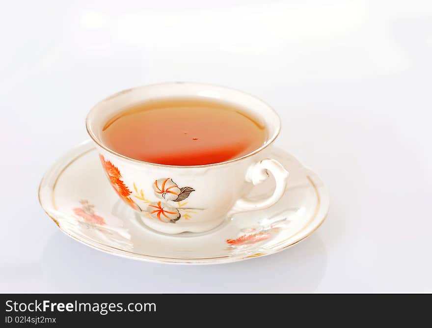 Cup of tea over white background