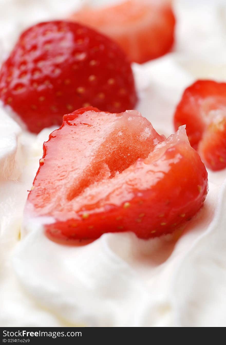 Fresh strawberries on cream high resolution image