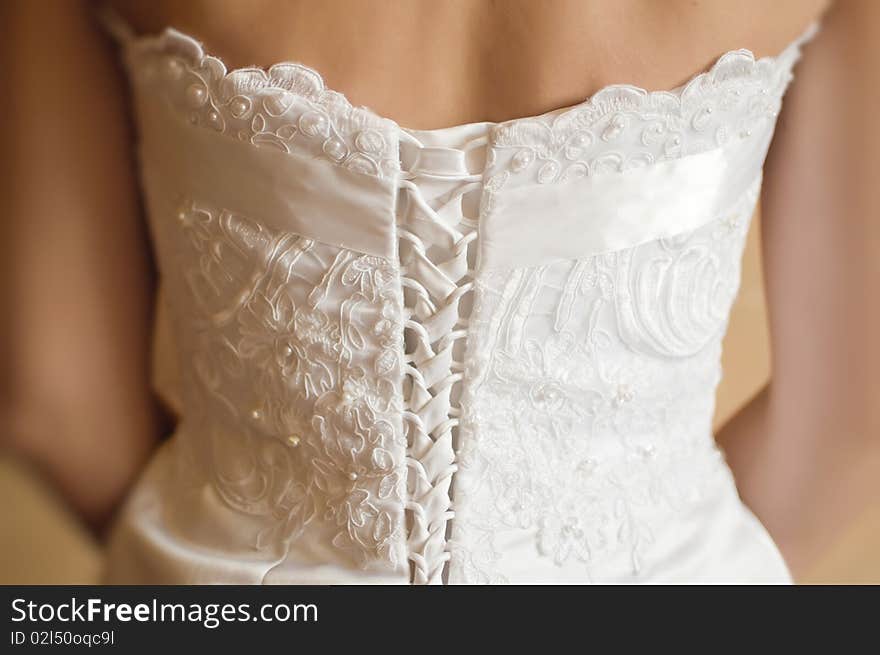 A beautiful traditional white wedding dress detail