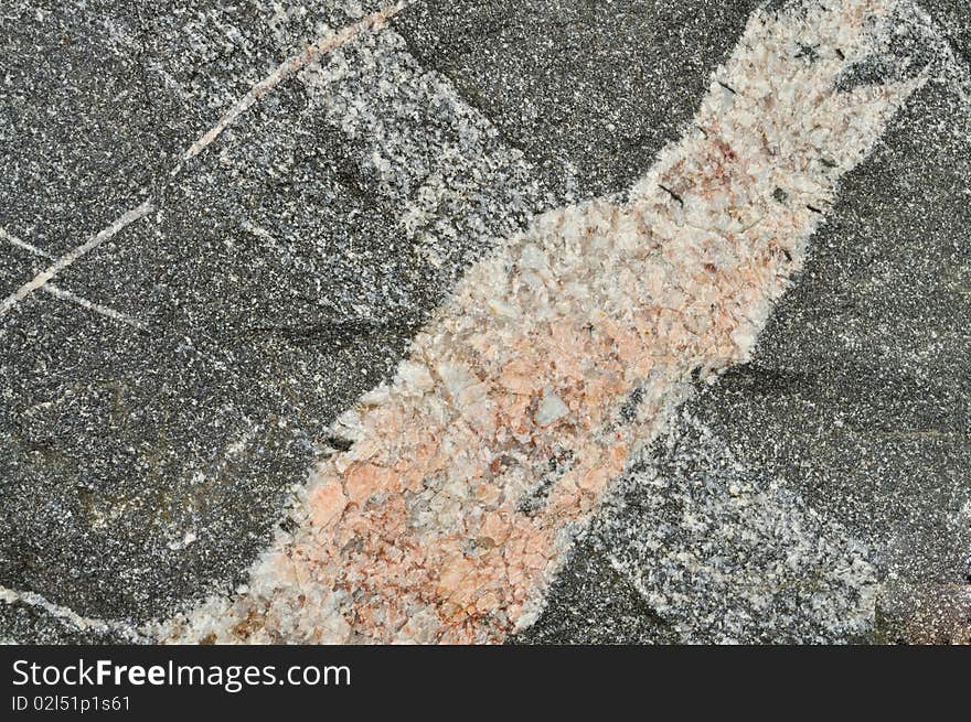 Granite texture. Small fragment of big stone