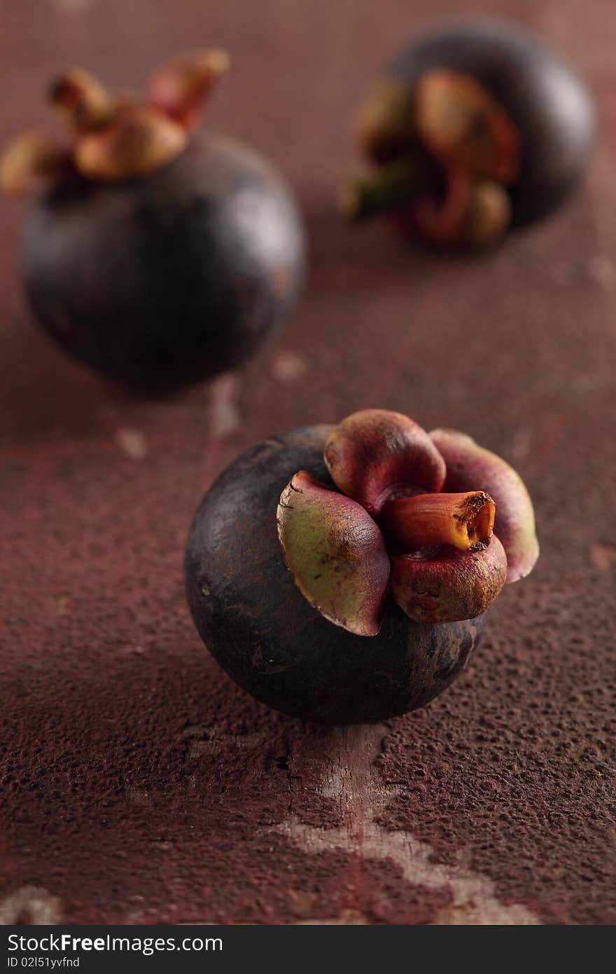 Three mangosteens