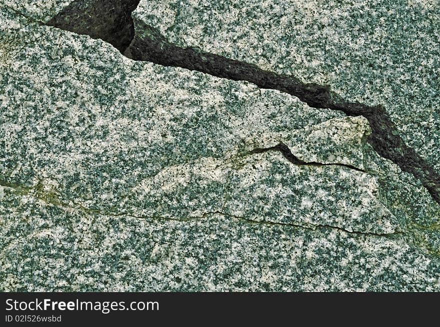 Crack. Granite texture. Small fragment of big stone