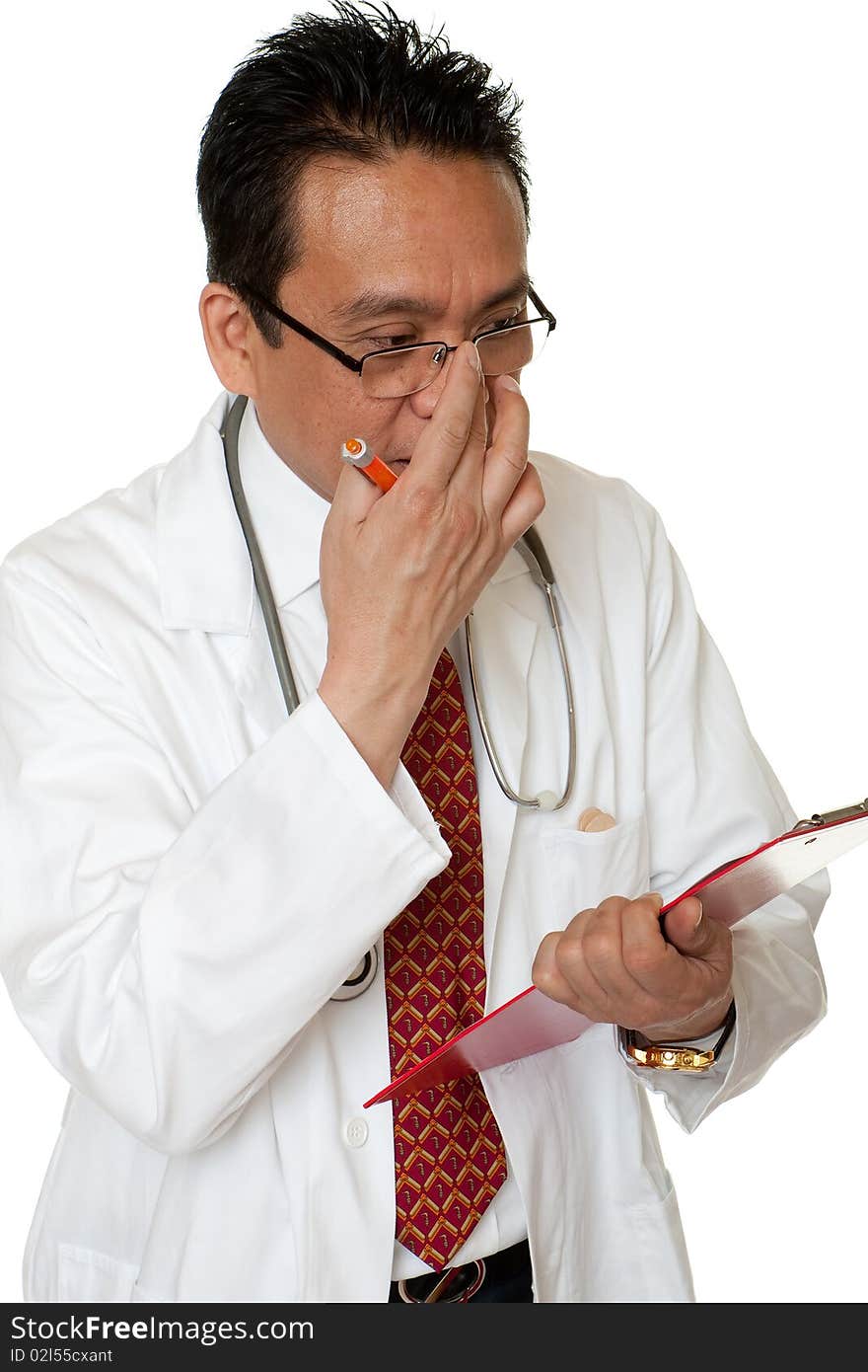 Friendly doctor while writing down diagnosis, studio admission before white background