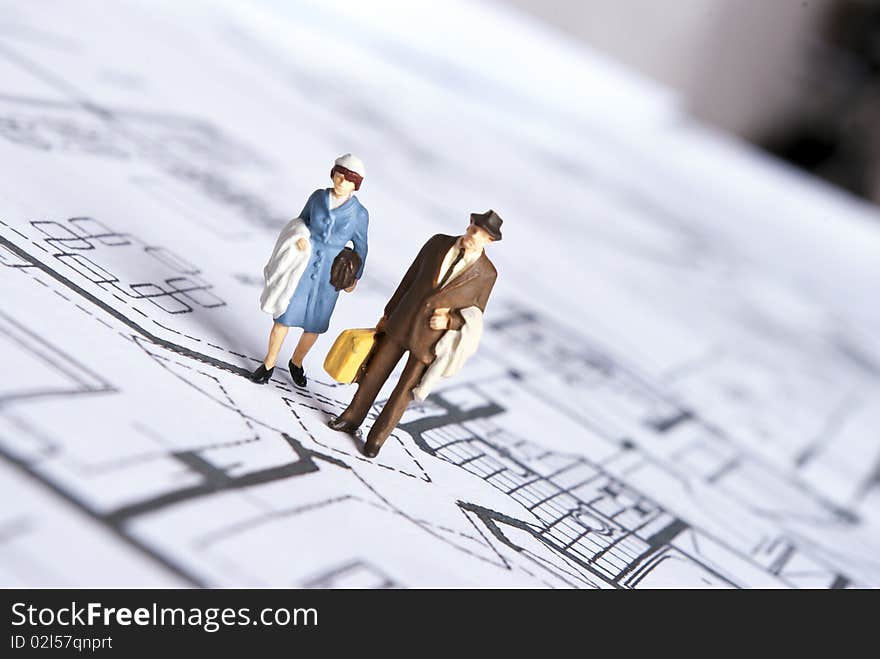 Miniature people on plans document